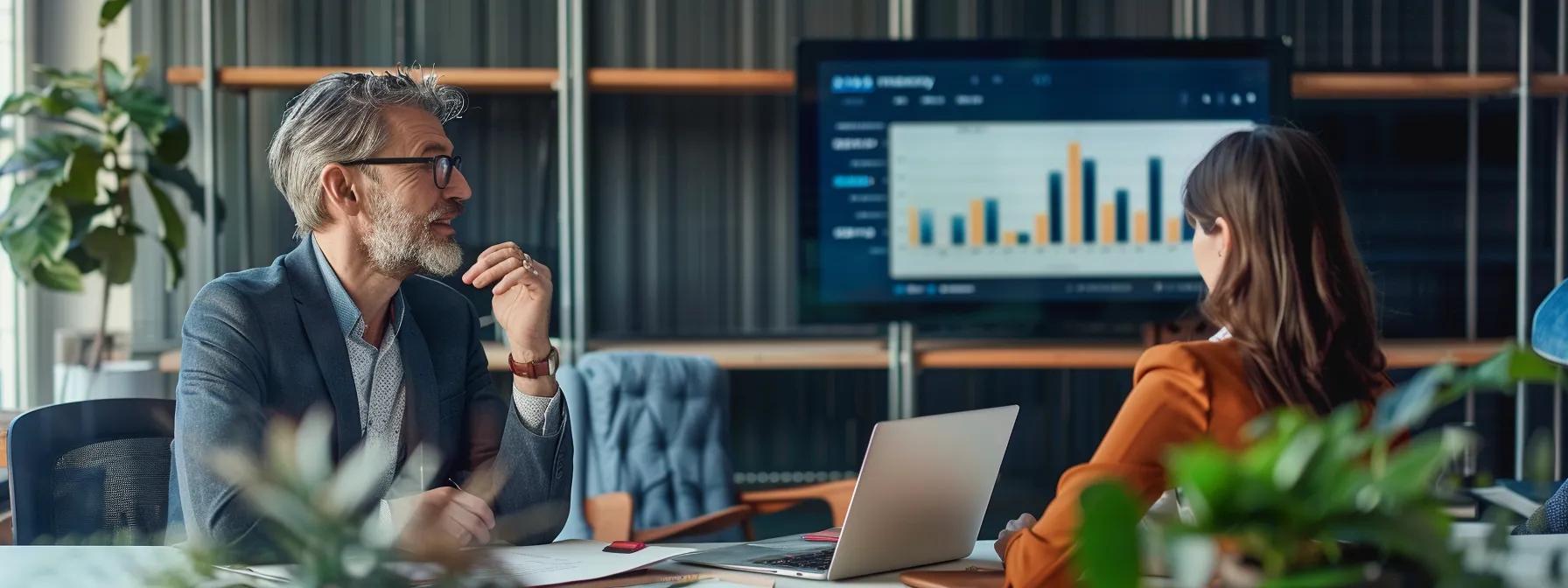 Professional real estate agent consulting with a client in an office, discussing mortgage options and foreclosure strategies, with a financial chart displayed on a screen.