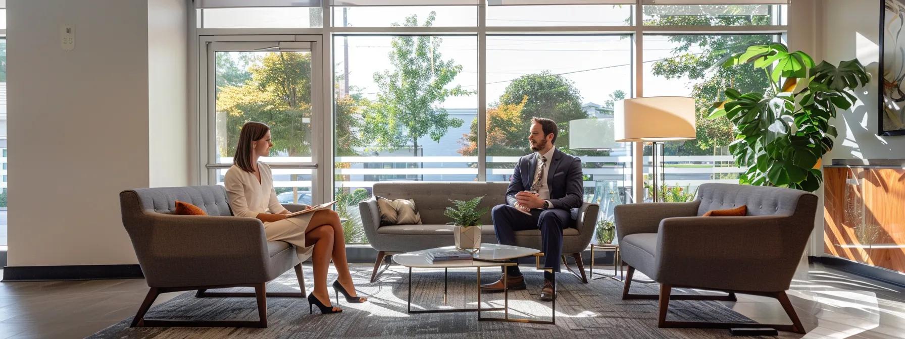 Modern office setting with a woman in a white dress and a man in a suit discussing home staging.
