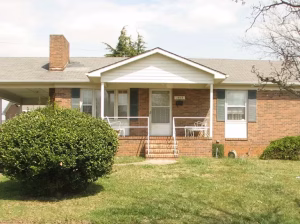 This brick house with manicured yard was purchased by Amran Property Investments in Winston-Salem